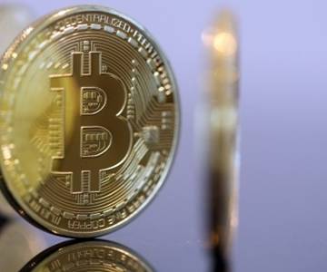 Giá Bitcoin tăng mạnh, vượt 11.000 USD